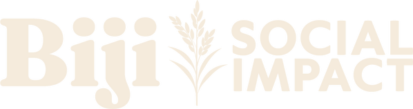 The Biji Social Impact logo, featuring the brand name separated by a stylized vertical rice panicle graphic. The word "Biji" is set in an elegant, bold serif font to the left, balanced by "Social Impact" in a clean, geometric sans-serif font to the right.
